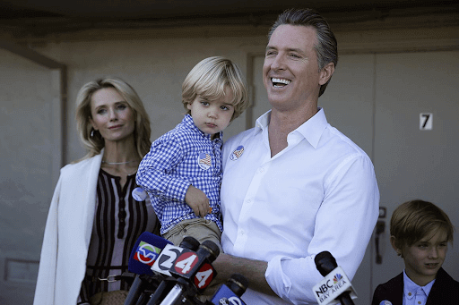 governor gavin newsom and jennifer newsome speak to the california media with their children