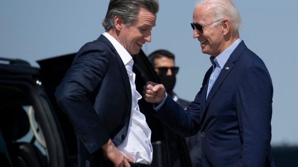 gavin newsom and joe biden laugh together at a campaign stop