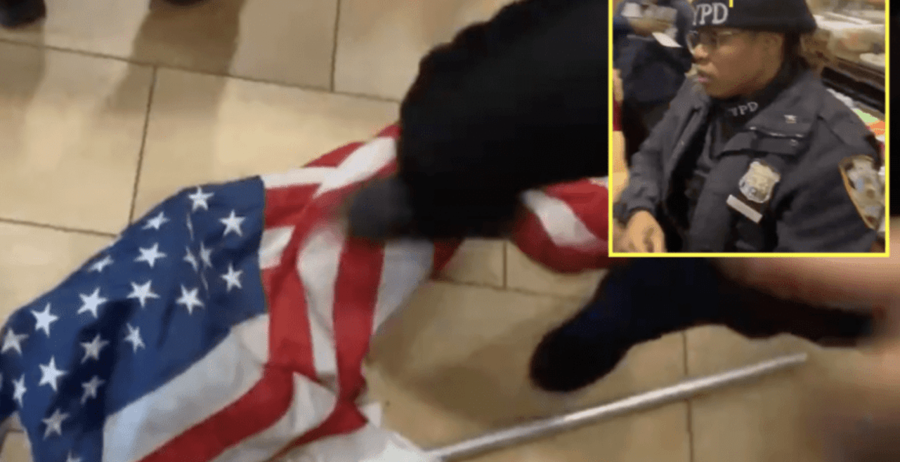 nypd officer stomping us american flag over vaccination papers