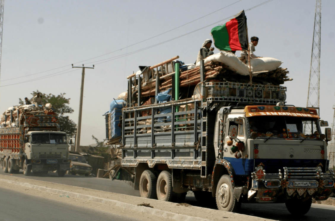 afghan refugees driving in trucks