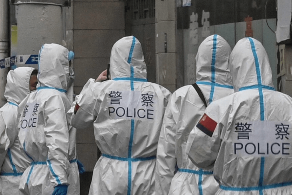 china's police wearing hazmat suits